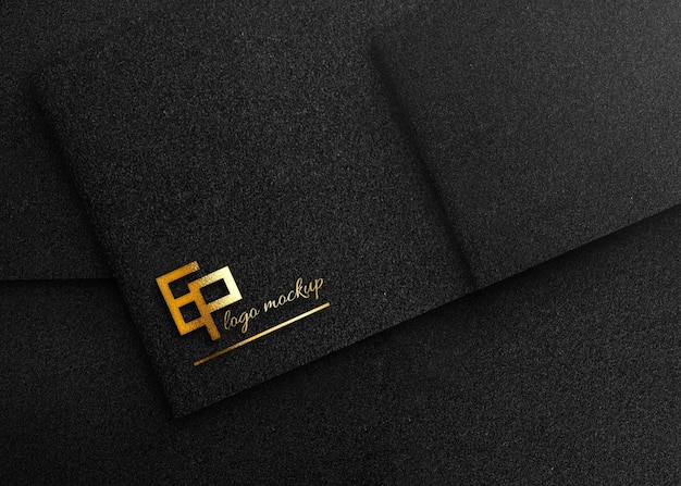 PSD gold logo mockup on black paper