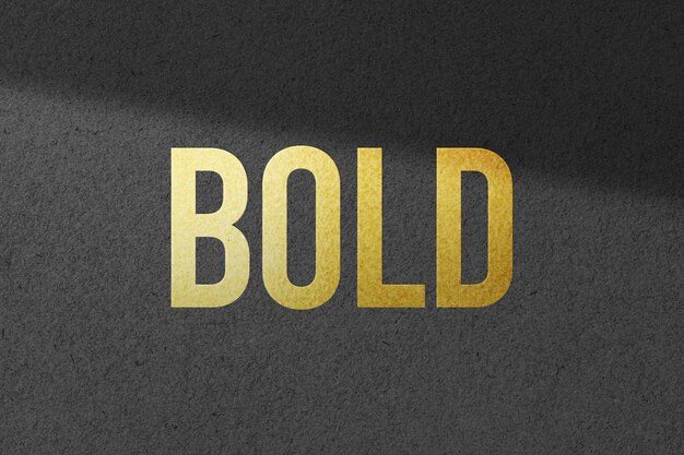 Gold logo mockup on black wall texture background