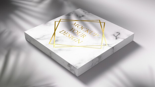 Gold logo mockup on marble with shadow leaves
