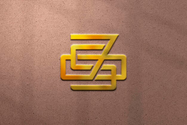 Золотой макет логотипа с абстрактным узором на текстурированном фоне