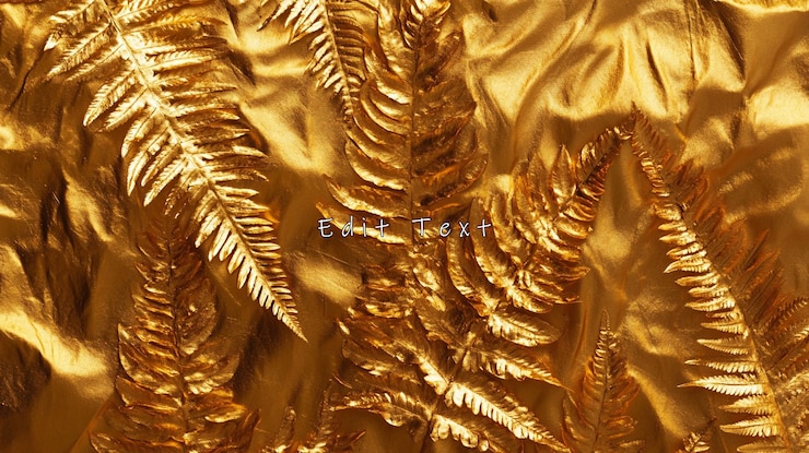 PSD golden fern leaves on gold fabric