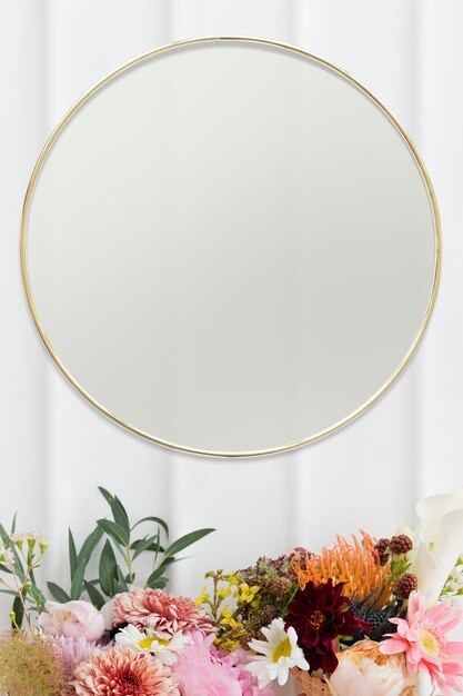 Golden floral frame on white wall