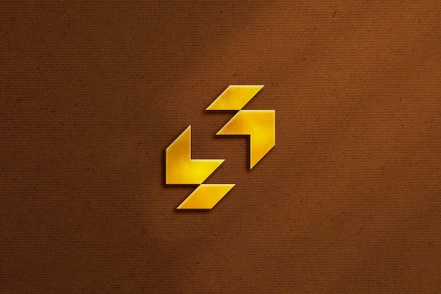 Золотой макет логотипа на коричневом фоне