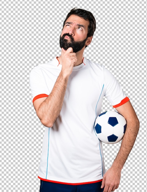 PSD gracz futbolu trzyma piłki nożnej piłki główkowanie
