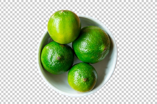 Green lemons in white bowl isolated transparent background png