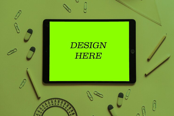 PSD green tablet mockup psd surrounded by school supplies