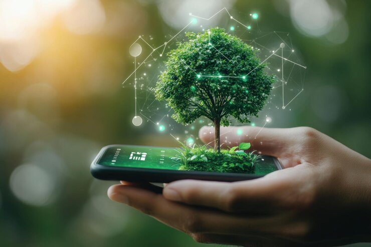 PSD green tree growing on a smartphone in a hand representing technology and nature