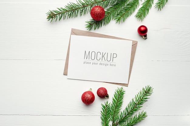 Greeting card mockup with Christmas decorations and fir tree branches