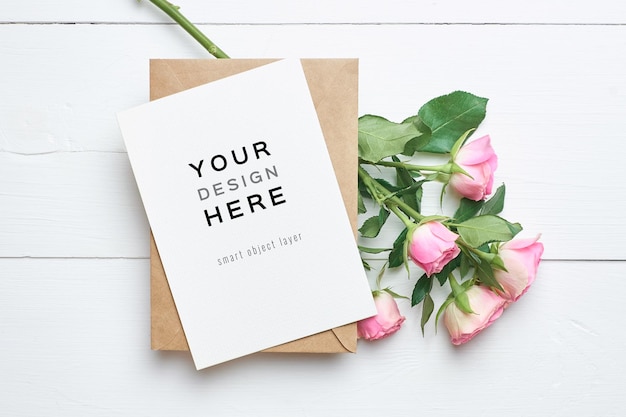 Greeting card mockup with envelope and fresh roses flowers