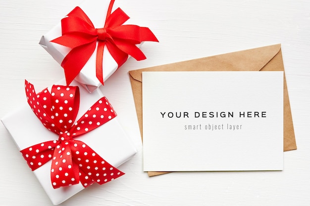 PSD greeting card mockup with envelope and gift boxes on white background