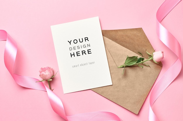 Greeting card mockup with envelope, pink ribbon and rose flower