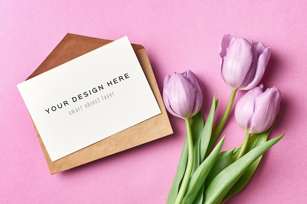 Greeting card mockup with envelope and purple tulip flowers