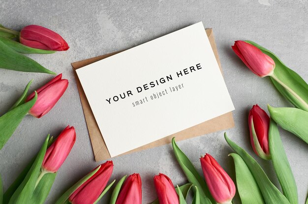 Greeting card mockup with envelope and red tulip flowers