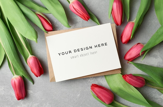 Greeting card mockup with envelope and red tulip flowers