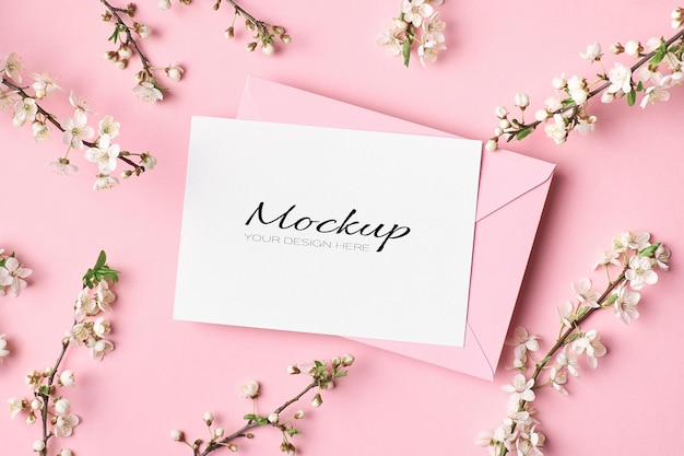 Greeting card mockup with envelope and spring tree twigs with flowers