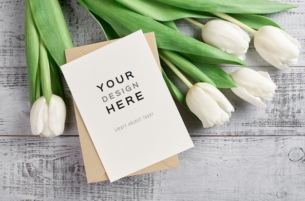 Greeting card mockup with envelope and tulip flowers