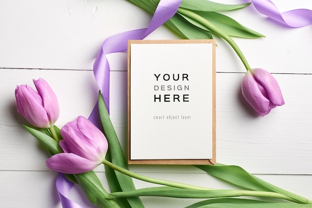 Greeting card mockup with purple tulips and ribbons