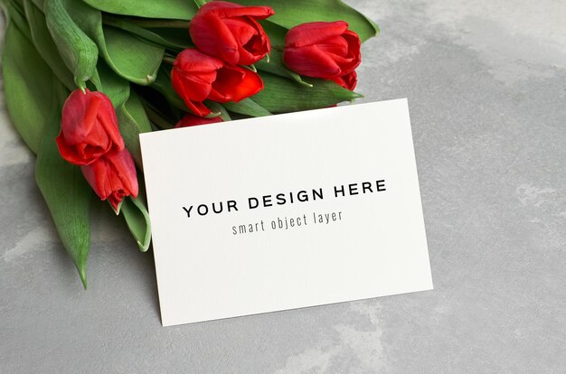 Greeting card mockup with red tulip flowers bouquet  