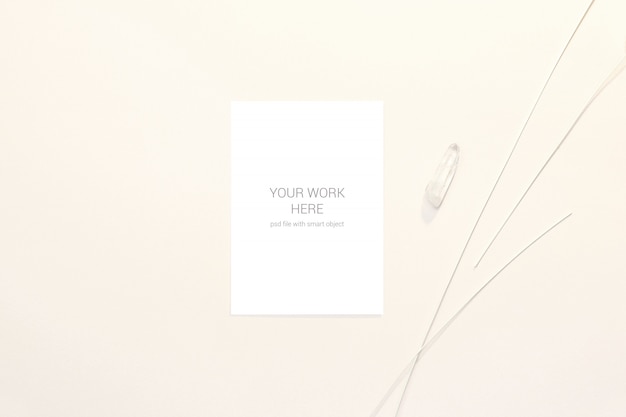 Greeting card mockup with white stone and branches