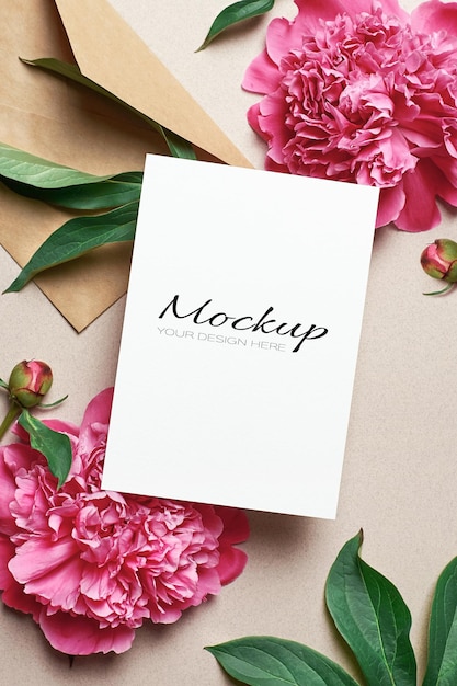 Greeting card stationary mockup with envelope and pink peony flowers