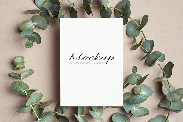 Greeting or invitation card mockup with green eucalyptus twigs