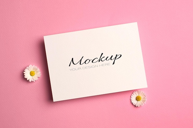 PSD greeting or wedding invitation card mockup with daisy flowers on pink