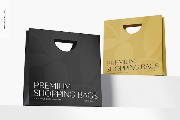 PSD grip hole shopping bags mockup, low angle view