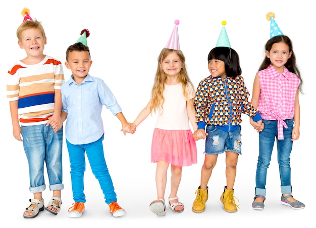 Group of diverse kids holding hands in a party hat