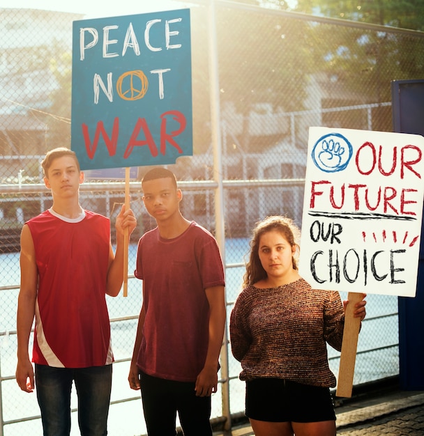 PSD group of teenagers protesting demonstration holding posters antiwar justice peace concept