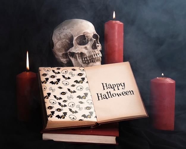 PSD halloween-concept met schedelkaarsen en boek