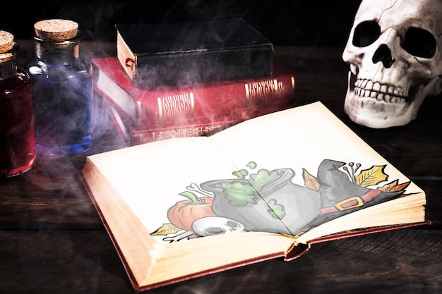 PSD halloween desk decoration with open book and mist