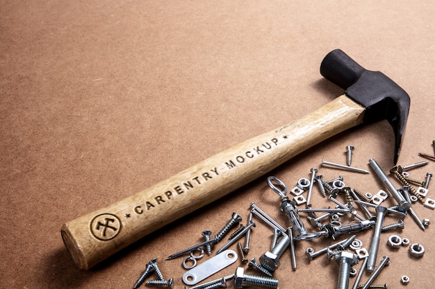 PSD hammer with wooden handle and engraved text effect mock-up