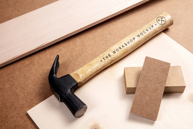 Hammer with wooden handle and engraved text effect mock-up