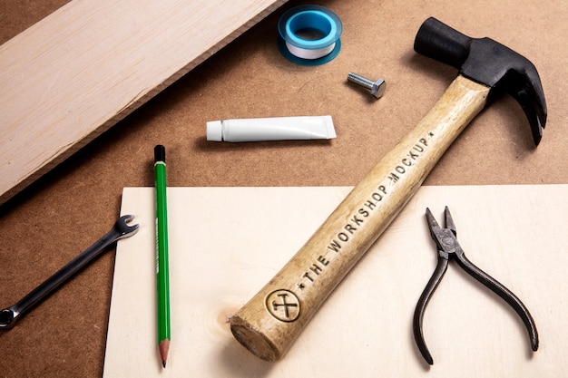 PSD hammer with wooden handle and engraved text effect mock-up