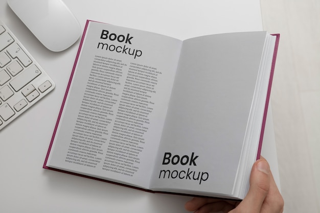 PSD hand holding book mock-up