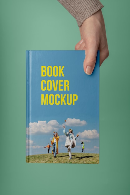 Mockup del libro della holding della mano