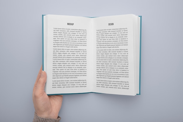 PSD hand holding  book mockup