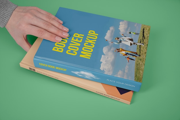 Hand holding  book mockup