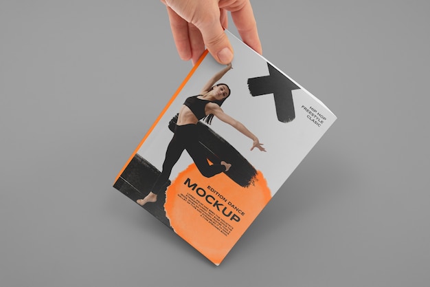 PSD hand holding book mockup