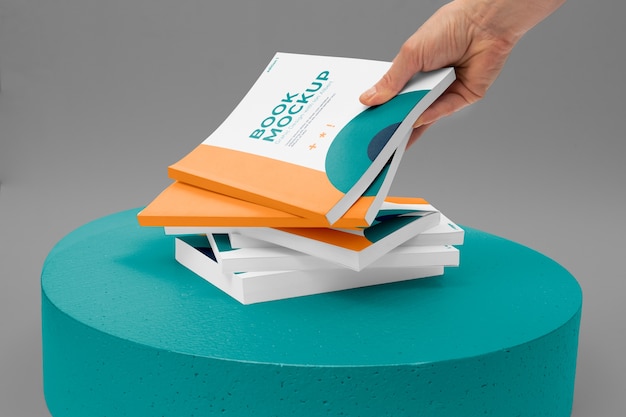 Hand holding book mockup