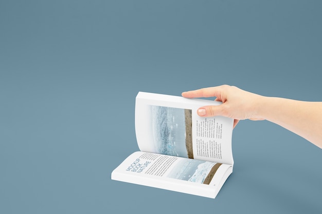 PSD hand holding book mockup