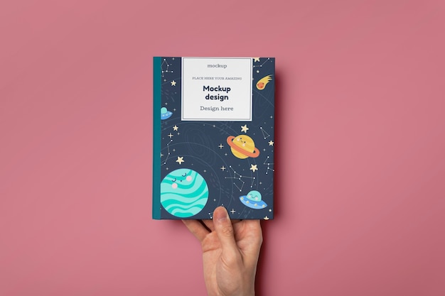 PSD hand holding book mockup