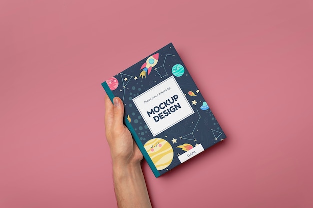 hand holding book mockup
