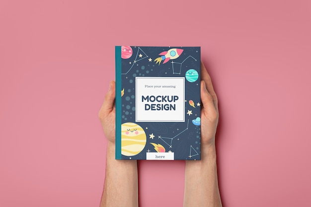 hand holding book mockup