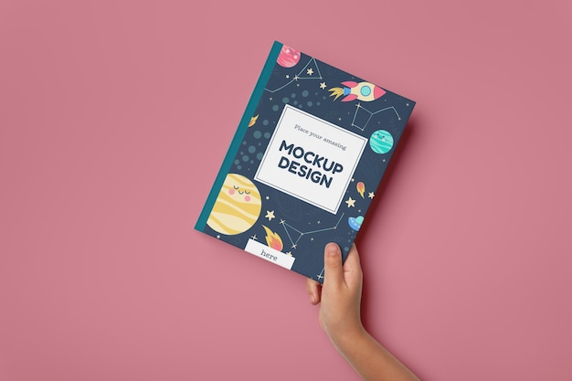 hand holding book mockup