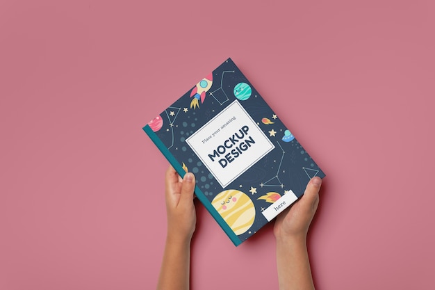 hand holding book mockup