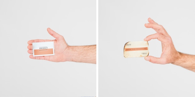 Hand holding business card mockup