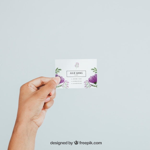 Hand holding business card's mock up 