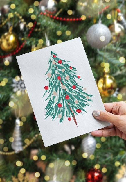 PSD hand holding christmas holiday greeting design mockup card