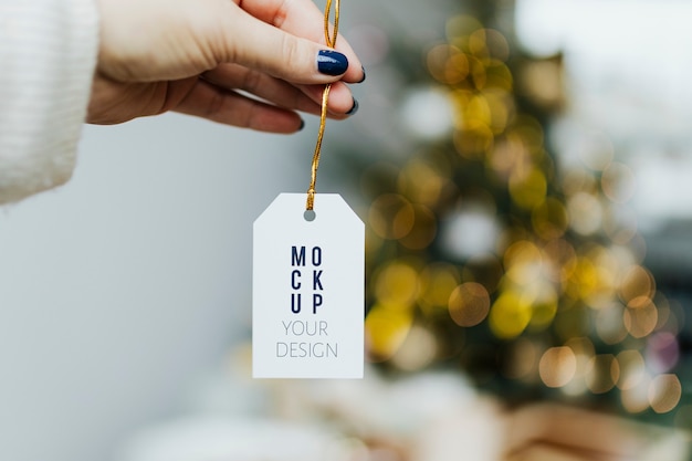 PSD hand holding christmas tag template